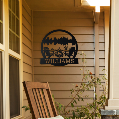 Personalized lake metal sign that is hanging on the front porch of the house. This sign has chairs, fire pit, lake, trees, and a place to add your wording.