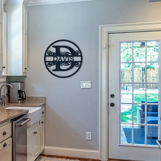 Split Letter Metal Monogram that is hanging on a wall by the back door.