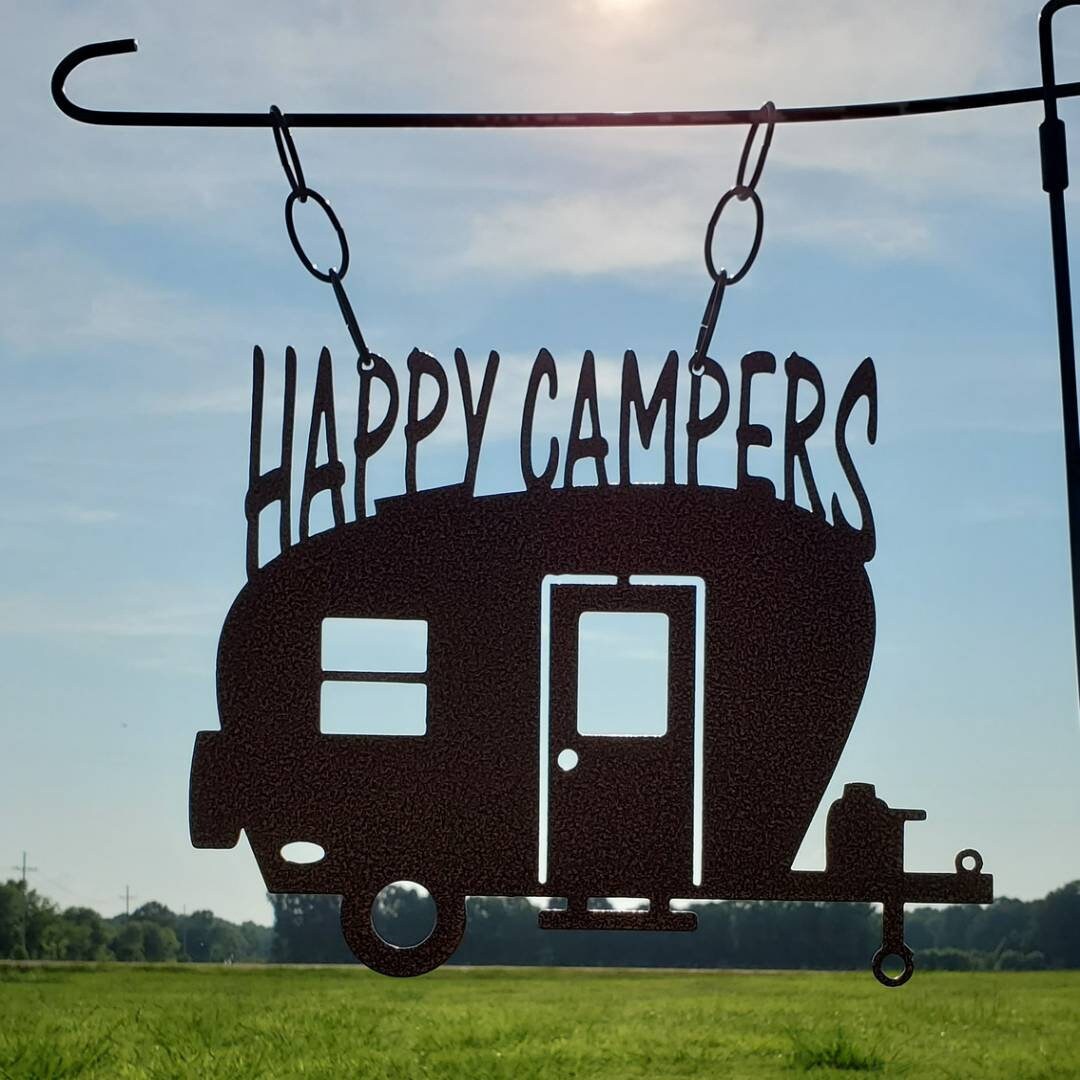 Metal Garden Flag that is a camper sign that has Happy Camper at the top.