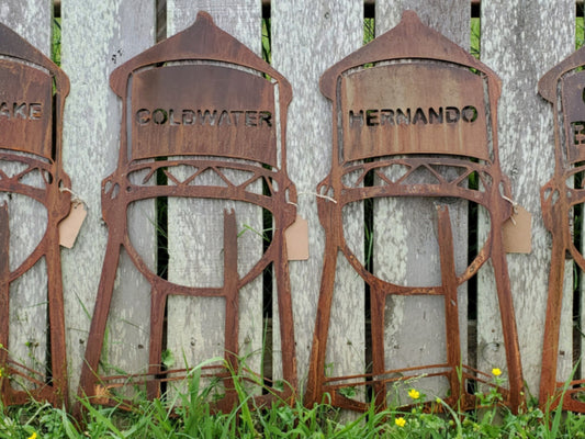 Personalized Metal Sign that is a Water Tower. You can add your Last Name, Initials, Wedding Date, or anything you would like.