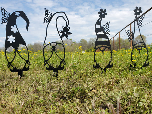 Metal yard art that is garden gnomes to add to your yard.