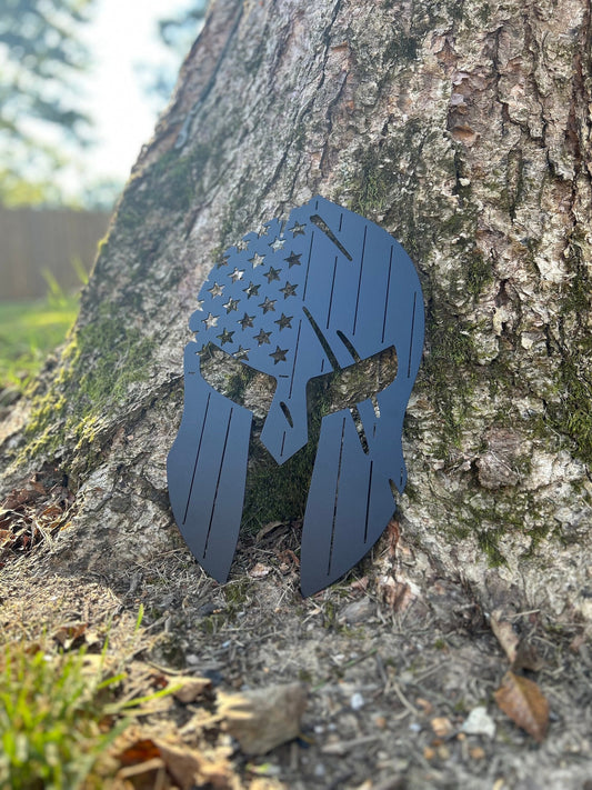 Metal American flag sign that is also a spartan helmet