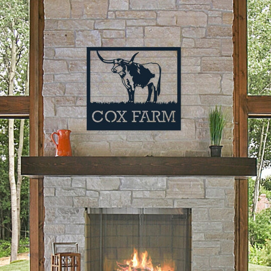 Personalized metal longhorn sign that is hanging over the fireplace.