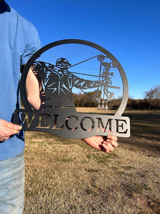 Personalized metal sign that has a bow hunter with a compound bow. The bottom has a place for your wording.