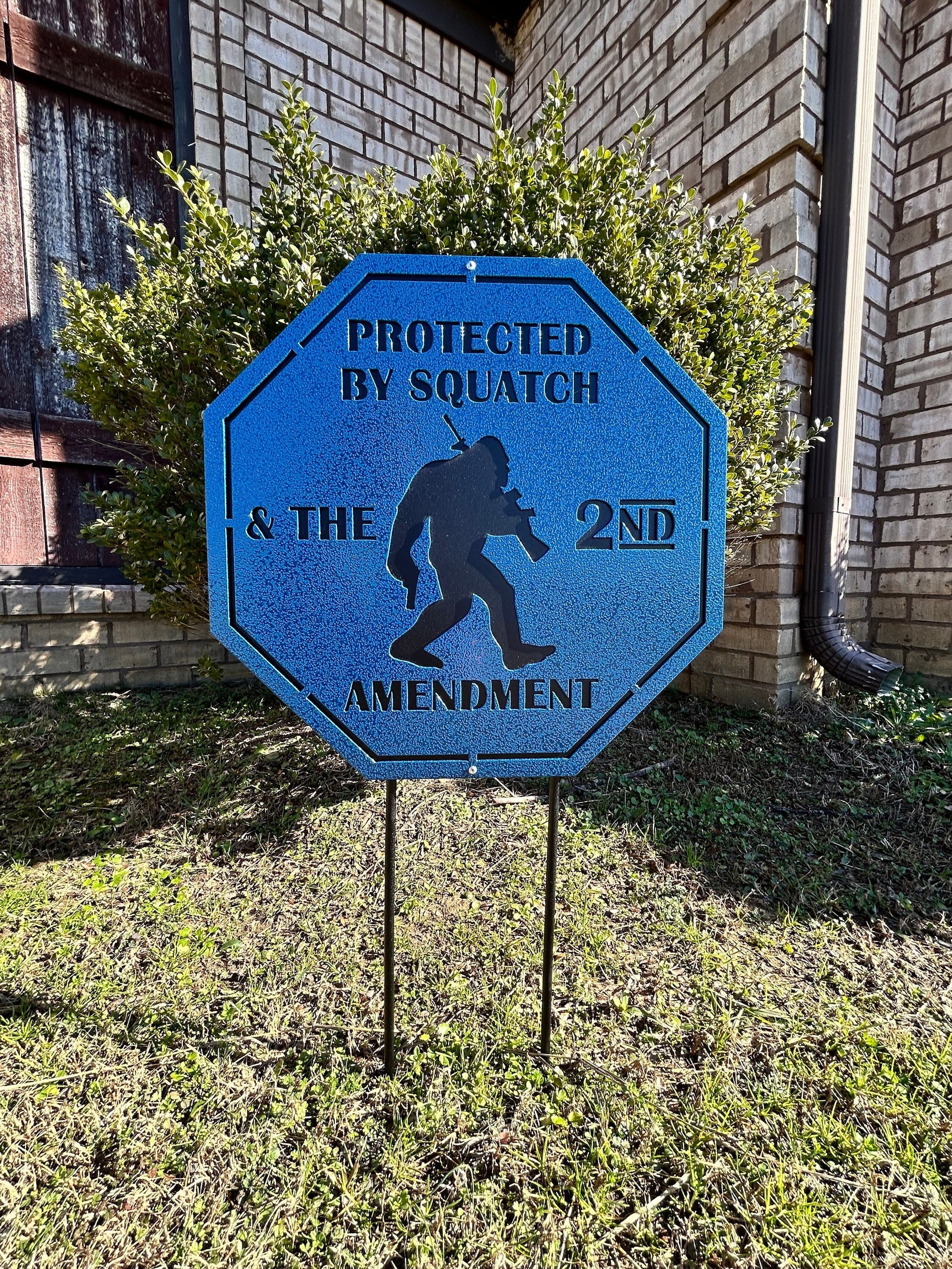 Home security lawn sign that has bigfoot on it and 2nd amendment.